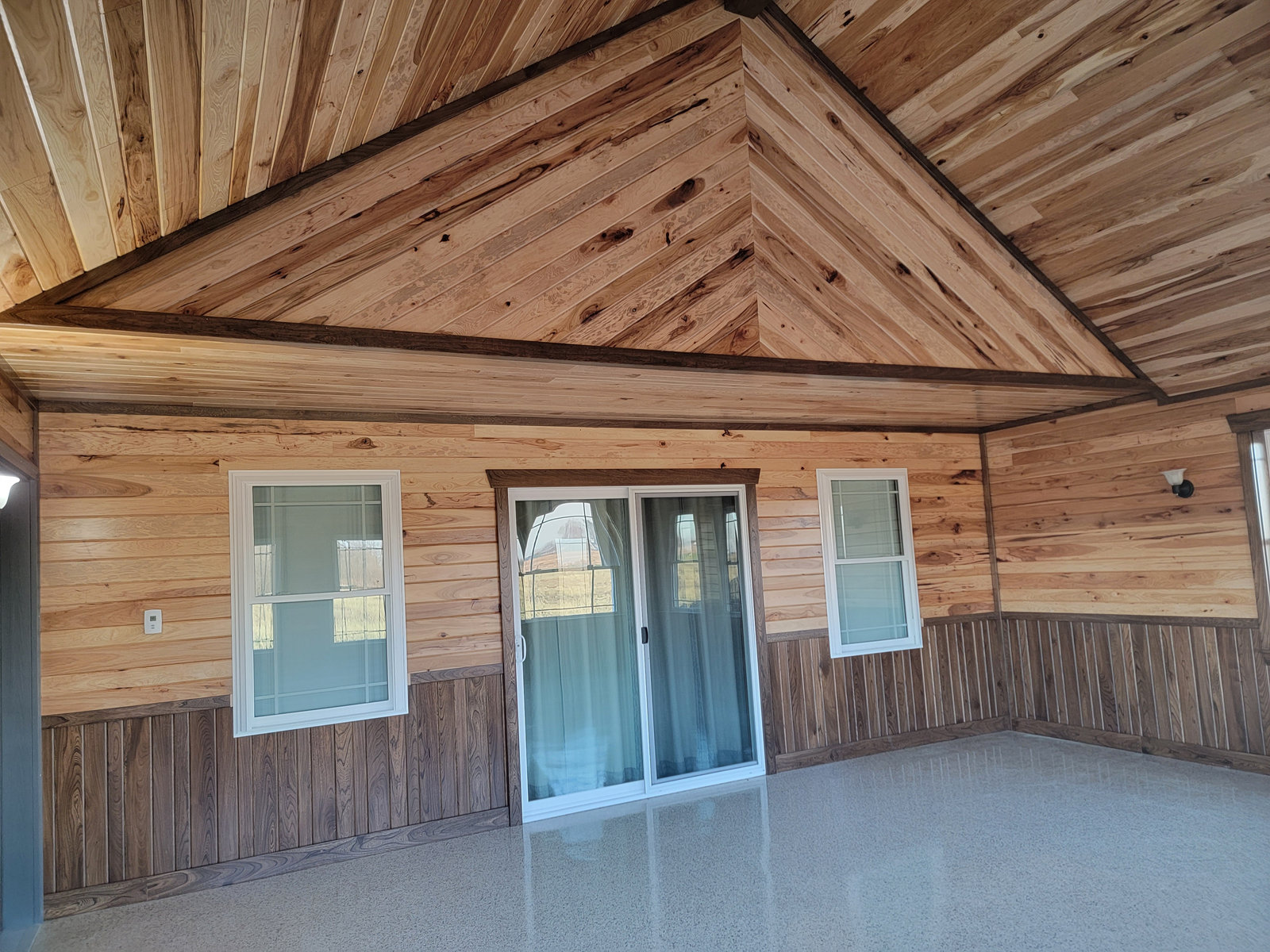 Finished room addition interior with vaulted tongue and groove wood ceiling in Northern Indiana