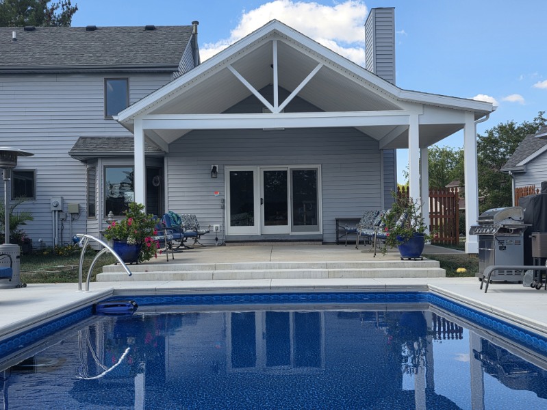 Open covered pool pavilion with decorative gable trusses built by T&J Construction